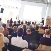 Speaker Giving a Talk at Business Meeting. Audience in the conference hall. Business and Entrepreneurship.