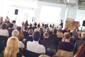 Speaker Giving a Talk at Business Meeting. Audience in the conference hall. Business and Entrepreneurship.